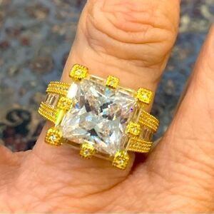 Size 7 gold over silver solitaire . Unique square stone and setting